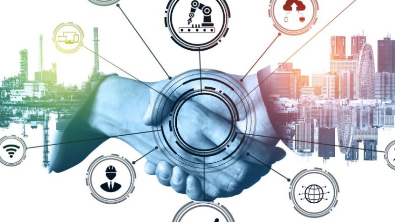 Poignée de main entre deux personnes avec des icônes technologiques connectées représentant lindustrie 40 et la collaboration numérique