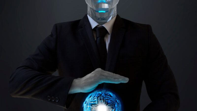 Robot humanoïde en costume tenant une sphère lumineuse symbolisant lautomatisation industrielle et lIA