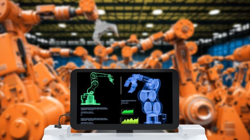 Poste de contrôle affichant des schémas de bras robotisés dans une usine de robots industriels